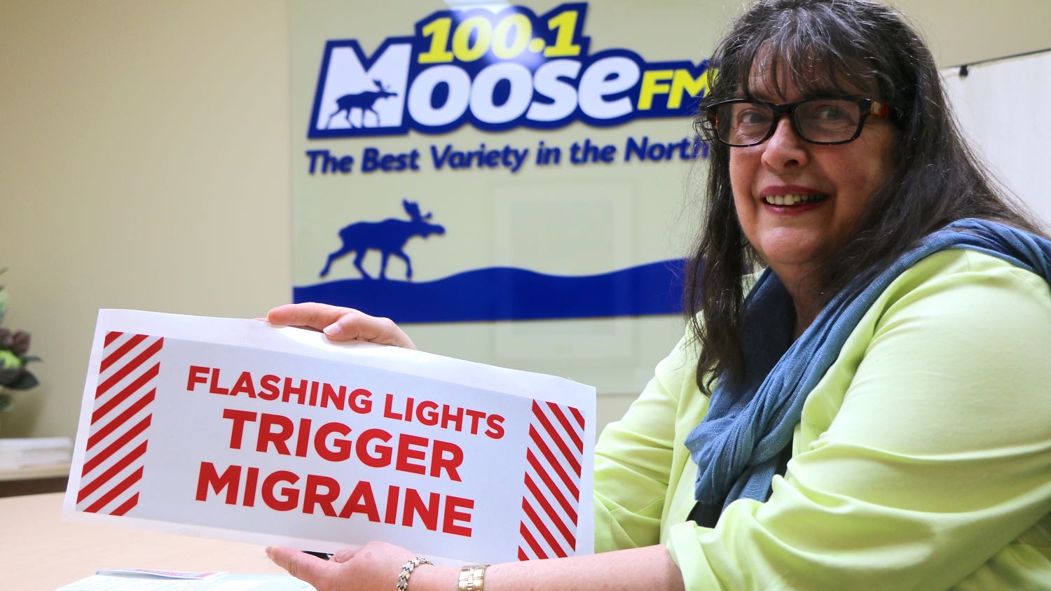 Lona Hegeman with her migraine warning sign
