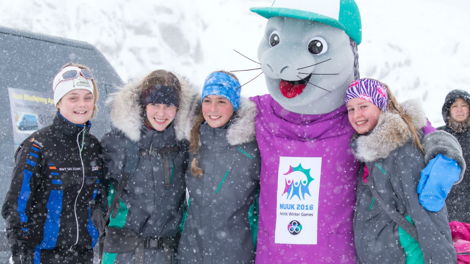 Skiers with mascot