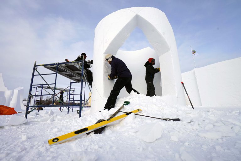 Snow carvers descend onto Yellowknife Bay